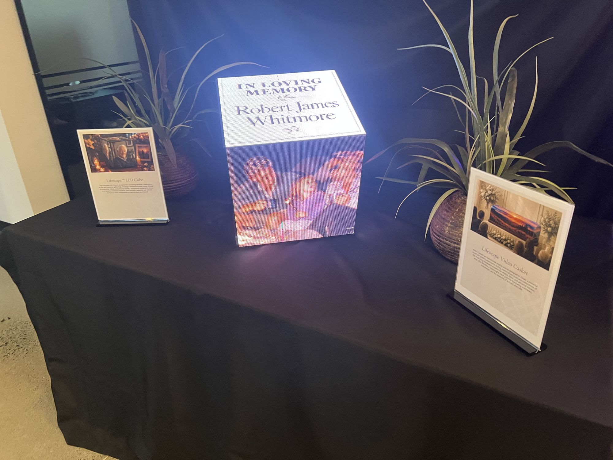 A lit photo memory cube showing pictures of a life