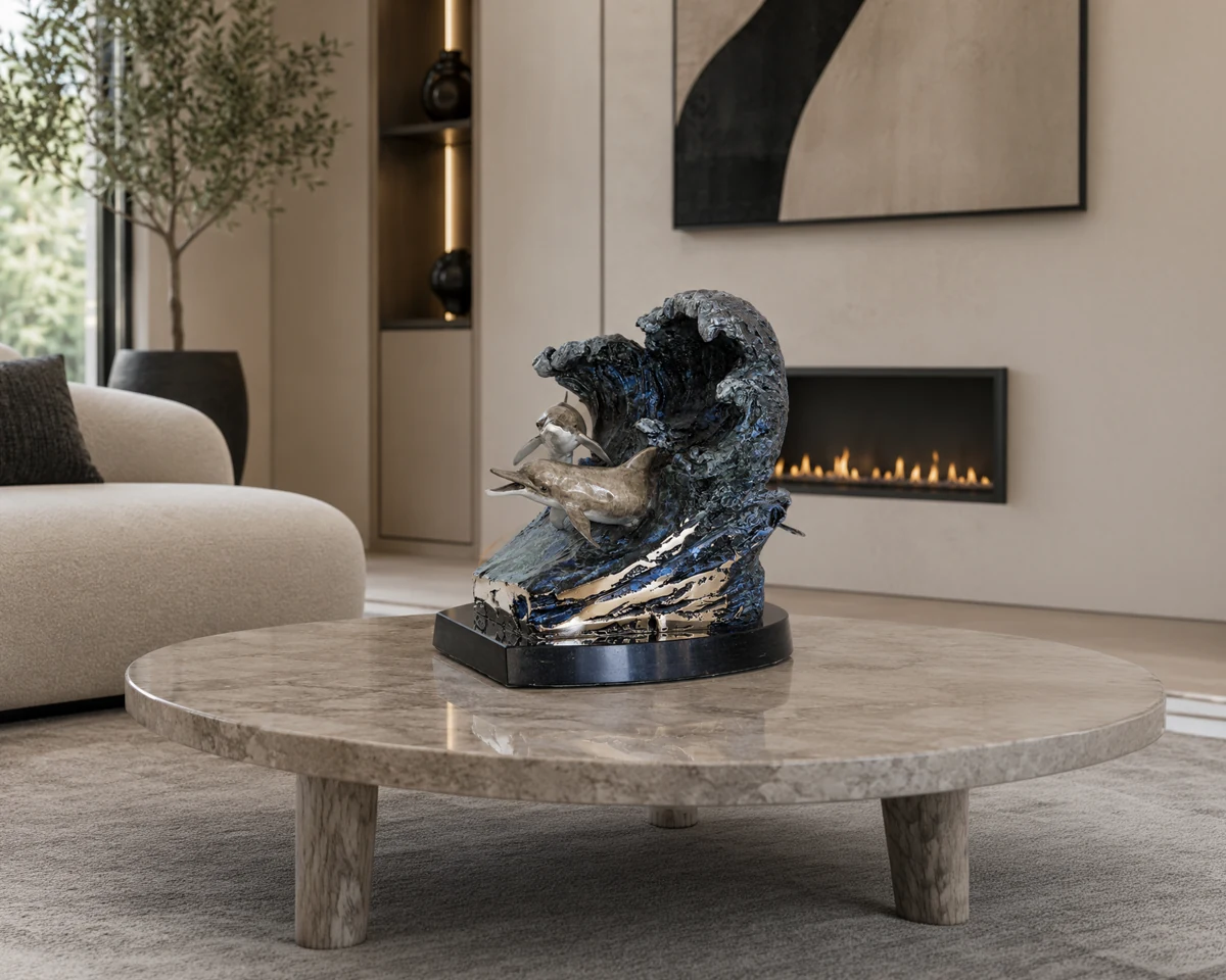 Wyland® dolphin memorial sculpture, displayed in a lifestyle setting.