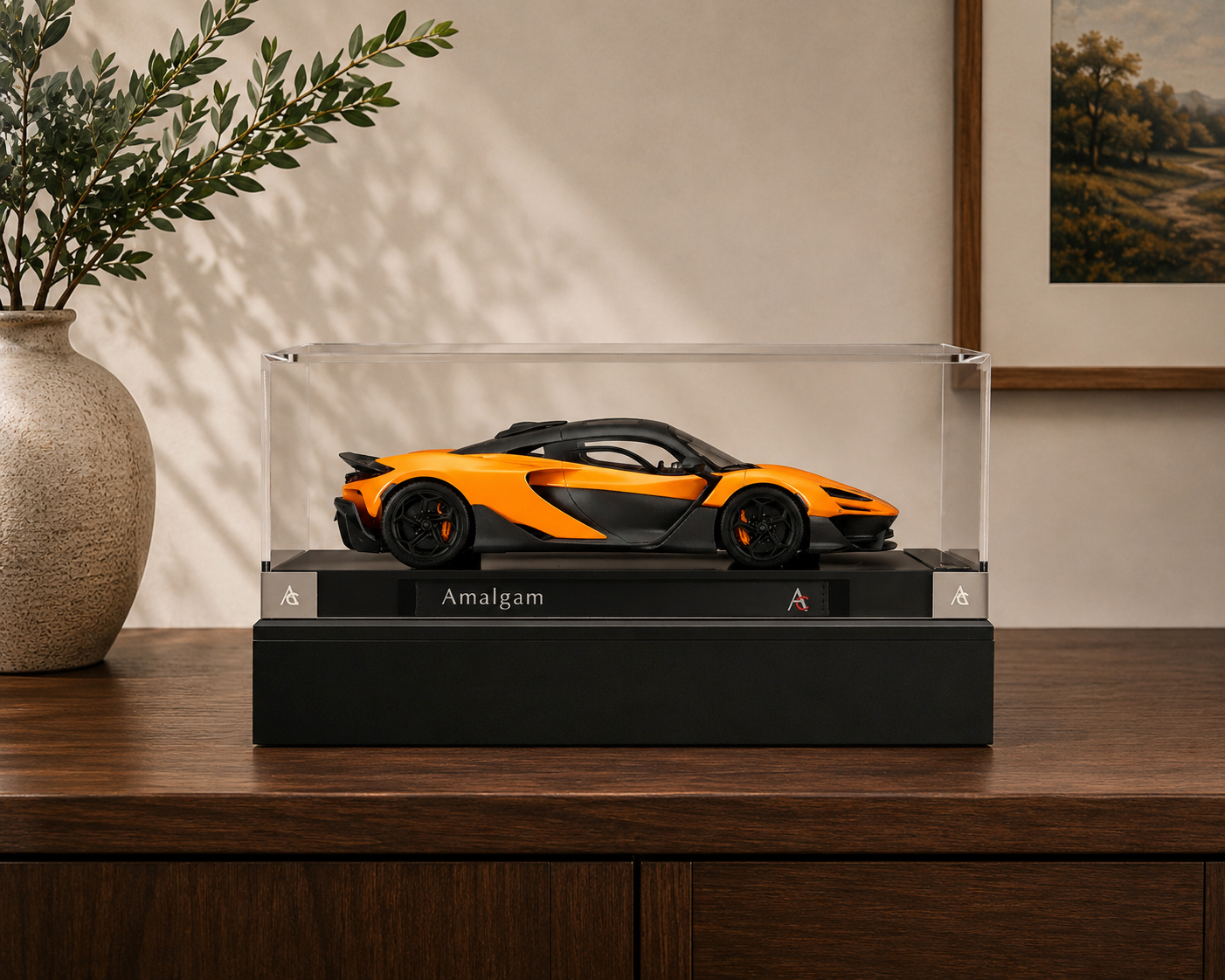 An Amalgam McLaren W1 scale model on a memorial riser